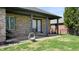 Comfortable covered back porch features brick columns and offers a relaxing outdoor space at 7709 Santolina Dr, Indianapolis, IN 46237