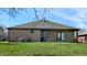 View of the backyard featuring a well-manicured lawn and covered patio at 7709 Santolina Dr, Indianapolis, IN 46237