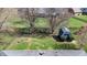 Aerial view of a lush backyard featuring green grass, a shed, fire pit and a mix of open space perfect for outdoor enjoyment at 7709 Santolina Dr, Indianapolis, IN 46237