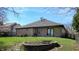 Expansive backyard with brick patio and lush lawn perfect for outdoor entertaining and relaxation at 7709 Santolina Dr, Indianapolis, IN 46237