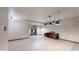 Spacious basement with tile flooring and decorative lighting fixtures, perfect for a recreation room or entertainment area at 7709 Santolina Dr, Indianapolis, IN 46237
