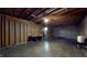 Unfinished basement with wooden framing and ceiling, providing a blank canvas to design a recreational or storage area at 7709 Santolina Dr, Indianapolis, IN 46237
