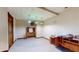 Bright basement featuring a classic tile floor, vintage lighting, and versatile space for hobbies or storage solutions at 7709 Santolina Dr, Indianapolis, IN 46237