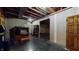 Unfinished basement with potential; exposed ductwork, wooden beams, and open space offer opportunities for customization and expansion at 7709 Santolina Dr, Indianapolis, IN 46237
