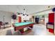 Finished basement complete with a pool table, wet bar, and extra living space at 7709 Santolina Dr, Indianapolis, IN 46237