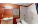 Bathroom showcasing a pristine white whirlpool tub, tiled walls, and a large mirror for a bright and airy feel at 7709 Santolina Dr, Indianapolis, IN 46237