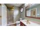 Bathroom with a glass enclosed shower and stylish single sink vanity at 7709 Santolina Dr, Indianapolis, IN 46237