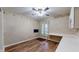 Cozy bedroom featuring a window, desk space, and wood-look flooring at 7709 Santolina Dr, Indianapolis, IN 46237