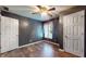 Bedroom featuring gray walls, hardwood floors, and a classic ceiling fan at 7709 Santolina Dr, Indianapolis, IN 46237