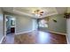 Bedroom with hardwood flooring, a ceiling fan, and an ensuite bathroom at 7709 Santolina Dr, Indianapolis, IN 46237