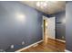 Bedroom featuring hardwood floors, and a calming blue wall color at 7709 Santolina Dr, Indianapolis, IN 46237