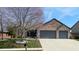 Beautiful home with a spacious driveway and landscaped front yard at 7709 Santolina Dr, Indianapolis, IN 46237