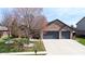 Lovely single-story brick home with an attached two-car garage and well-maintained lawn at 7709 Santolina Dr, Indianapolis, IN 46237