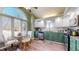 Well-lit kitchen with stainless appliances, granite counters and a breakfast nook next to a large window at 7709 Santolina Dr, Indianapolis, IN 46237