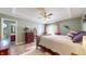 Cozy bedroom with ceiling fan, ensuite bathroom and walk in closet at 7709 Santolina Dr, Indianapolis, IN 46237