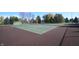 Outdoor tennis courts with green playing surface at 7709 Santolina Dr, Indianapolis, IN 46237