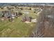 Expansive lot with mature trees featuring a brick home and a long private driveway at 9263 Compton Farm Ln, Indianapolis, IN 46259