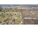 This aerial image highlights a home surrounded by farmland for privacy at 9263 Compton Farm Ln, Indianapolis, IN 46259