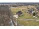Brick home in a rural neighborhood with a long driveway and basketball hoop at 9263 Compton Farm Ln, Indianapolis, IN 46259