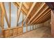 Unfinished attic shows the construction and framework of the home's structure at 9263 Compton Farm Ln, Indianapolis, IN 46259