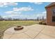 A large stone patio and fire pit provide a relaxing outdoor gathering space at 9263 Compton Farm Ln, Indianapolis, IN 46259