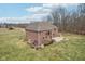 Brick home featuring a built-in firepit and patio in a wooded neighborhood at 9263 Compton Farm Ln, Indianapolis, IN 46259