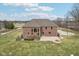 Brick home in rural neighborhood with a built in fire-pit, patio, and basketball court at 9263 Compton Farm Ln, Indianapolis, IN 46259