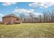Expansive backyard of the brick home, complemented by trees and a well-kept lawn at 9263 Compton Farm Ln, Indianapolis, IN 46259