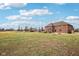 The home boasts a sprawling lawn and brick exterior, perfect for outdoor living at 9263 Compton Farm Ln, Indianapolis, IN 46259
