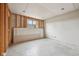 Unfinished basement with exposed framing, concrete floor, and a window for natural light at 9263 Compton Farm Ln, Indianapolis, IN 46259
