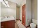 Bathroom featuring a long mirror, tile flooring, and a toilet at 9263 Compton Farm Ln, Indianapolis, IN 46259