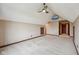 Spacious bedroom with an attic ceiling, large window, a ceiling fan, and built in shelving at 9263 Compton Farm Ln, Indianapolis, IN 46259