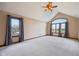 Large bedroom boasts vaulted ceiling, ceiling fan, and large windows for natural light at 9263 Compton Farm Ln, Indianapolis, IN 46259