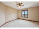 Bedroom featuring plush carpet, neutral walls, a ceiling fan, and a window offering natural light and outdoor views at 9263 Compton Farm Ln, Indianapolis, IN 46259
