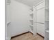 Walk-in closet features adjustable shelving and ample storage space for an organized wardrobe at 9263 Compton Farm Ln, Indianapolis, IN 46259