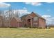 Elegant brick home featuring manicured landscaping and a spacious front lawn at 9263 Compton Farm Ln, Indianapolis, IN 46259