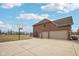 Exterior view of the house, with a garage, driveway, and basketball hoop at 9263 Compton Farm Ln, Indianapolis, IN 46259