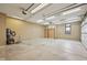 Spacious garage with ample lighting, electrical outlets, and plenty of room for storage and vehicles at 9263 Compton Farm Ln, Indianapolis, IN 46259