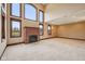 Bright living room with a cozy fireplace and large windows at 9263 Compton Farm Ln, Indianapolis, IN 46259
