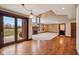 Open-concept living area with a fireplace and access to outdoor views at 9263 Compton Farm Ln, Indianapolis, IN 46259