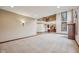 Generous living area with access to a kitchen, great light, and stylish fixtures at 9263 Compton Farm Ln, Indianapolis, IN 46259