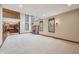 Spacious living room boasts a brick fireplace and large windows for natural light at 9263 Compton Farm Ln, Indianapolis, IN 46259