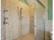 Shower featuring a glass door and light tan tiling with multiple shower heads at 9263 Compton Farm Ln, Indianapolis, IN 46259