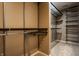 Spacious walk-in closet with custom shelving and rods at 10185 Plantana Blvd, Fishers, IN 46038