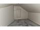 Unfinished attic room with wooden floors and walls at 139 S Jefferson St, Martinsville, IN 46151