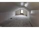Unfinished attic space with exposed wooden floors and walls at 139 S Jefferson St, Martinsville, IN 46151