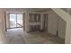 Unfinished basement with sliding glass door and exposed walls at 139 S Jefferson St, Martinsville, IN 46151