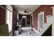 Unfinished hallway with red walls and stairs at 139 S Jefferson St, Martinsville, IN 46151