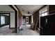 Hallway with red walls and exposed staircase at 139 S Jefferson St, Martinsville, IN 46151