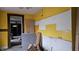Kitchen under construction with yellow walls at 139 S Jefferson St, Martinsville, IN 46151